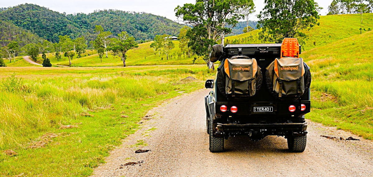 Ute with Crashpad wheel bags on a bush track
